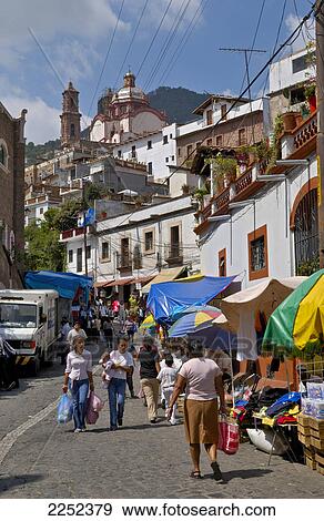 Tourists in street with church in background, San Sebastian y Santa Prisca, Taxco de Alarcon, Guerrero, Mexico View Large Photo Image Stock Photo - Tourists in street with church in background, San Sebastian y Santa Prisca, Taxco de Alarcon, Guerrero, Mexico . Fotosearch