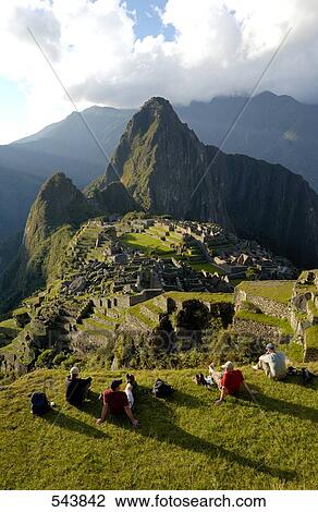 Tourists looking at old ruins on mountain, Inca Ruins, Machu Picchu, Cusco Region, Peru View Large Photo Image Stock Image - Tourists looking at old ruins on mountain, Inca Ruins, Machu Picchu, Cusco Region, Peru . Fotosearch