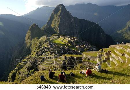 Tourists looking at old ruins on mountain, Inca Ruins, Machu Picchu, Cusco Region, Peru View Large Photo Image Stock Image - Tourists looking at old ruins on mountain, Inca Ruins, Machu Picchu, Cusco Region, Peru . Fotosearch