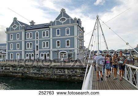Tourists on bridge leading to colonial building, Victoria & Albert Waterfront, Cape Town, South Africa View Large Photo Image Stock Image - Tourists on bridge leading to colonial building, Victoria & Albert Waterfront, Cape Town, South Africa . Fotosearch