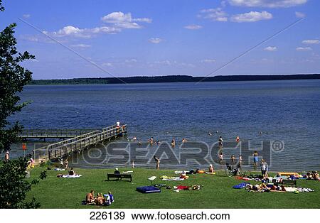 Tourists swimming in lake, Muritz, Mecklenburg-Vorpommern, Germany View Large Photo Image Stock Photo - Tourists swimming in lake, Muritz, Mecklenburg-Vorpommern, Germany . Fotosearch