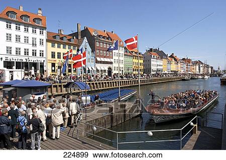 Tourists waiting for tourboat at harbor, Sjaelland, Copenhagen, Denmark View Large Photo Image Stock Photo - Tourists waiting for tourboat at harbor, Sjaelland, Copenhagen, Denmark . Fotosearch