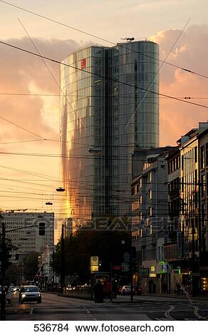 Transmission lines in front of buildings in city at dusk View Large Photo Image Picture - Transmission lines in front of buildings in city at dusk . Fotosearch