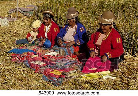 Uros women in traditional clothing doing needlework, Uros Floating Island, Lake Titicaca, Peru View Large Photo Image Stock Photo - Uros women in traditional clothing doing needlework, Uros Floating Island, Lake Titicaca, Peru . Fotosearch