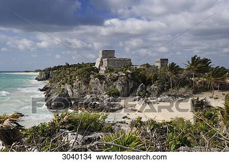 Picture - View over beach to complex of buildings of the Maya ruin site of Tulum, Riviera Maya, Mexico . Fotosearch