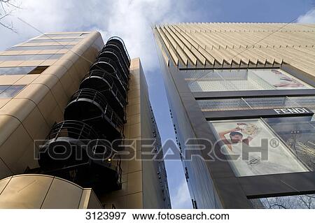 Advertising posters on the facade of a skyscraper, Tokyo, Japan, view from below View Large Photo Image Stock Photo - Advertising posters on the facade of a skyscraper, Tokyo, Japan, view from below . Fotosearch