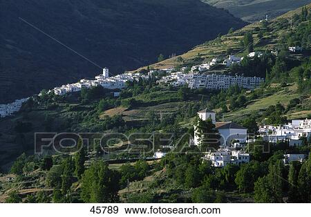 Aerial view of town on hill, Bubion, Capileira, Alpujarras, Sierra Nevada, Andalusia, Spain View Large Photo Image Stock Photo - Aerial view of town on hill, Bubion, Capileira, Alpujarras, Sierra Nevada, Andalusia, Spain . Fotosearch