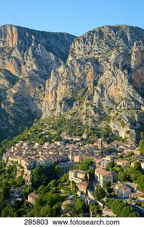 Stock Image - Aerial view of town on hill, Moustiers-Sainte-Marie, Gorges Du Verdon, Haute Provence, France . Fotosearch