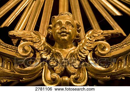 Stock Photograph - Angel sculpture carved on wall of church, Breil-sur-Roya, Provence-Alpes-Cote d'Azur, France . Fotosearch