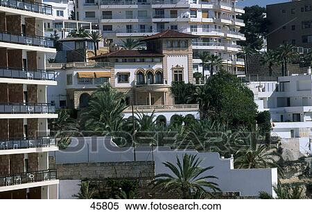 Apartments in city, Badia de Palmam, Cala Minor, Majorca, Balearic Islands, Spain View Large Photo Image Stock Photography - Apartments in city, Badia de Palmam, Cala Minor, Majorca, Balearic Islands, Spain . Fotosearch