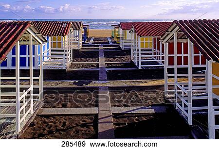 Beach huts in row on beach, Italy View Large Photo Image Stock Photo - Beach huts in row on beach, Italy . Fotosearch