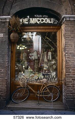 Bicycle in front of store display widow, Siena, Tuscany, Italy View Large Photo Image Stock Photograph - Bicycle in front of store display widow, Siena, Tuscany, Italy . Fotosearch
