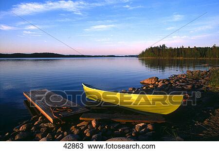 Stock Image - Boat at lakeside, Saimaa Lake, Loikansaari, Finland . Fotosearch