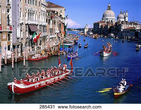 Boatmen rowing boats in canal, Grand Canal, Santa Maria Della Salute, Venice, Italy View Large Photo Image Stock Image - Boatmen rowing boats in canal, Grand Canal, Santa Maria Della Salute, Venice, Italy . Fotosearch