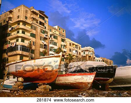 Boats in front of apartment buildings, Alexandria, Egypt View Large Photo Image Picture - Boats in front of apartment buildings, Alexandria, Egypt . Fotosearch