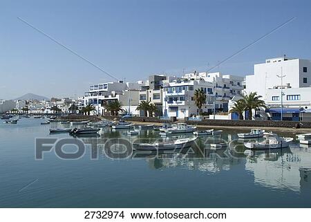 Boats moored at harbor View Large Photo Image Picture - Boats moored at harbor . Fotosearch