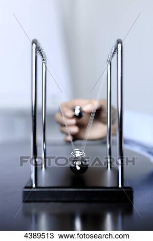 Stock Image - Bowl pendulum . Fotosearch
