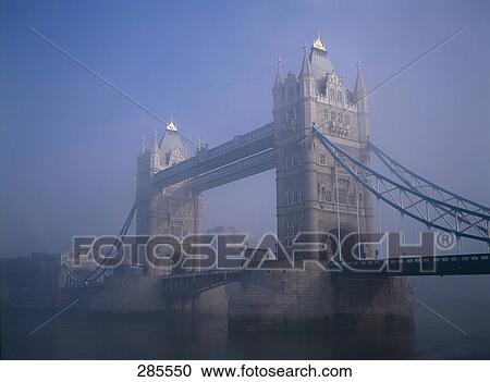 Bridge across river at dusk, Tower Bridge, Thames River, London, England View Large Photo Image Stock Image - Bridge across river at dusk, Tower Bridge, Thames River, London, England . Fotosearch