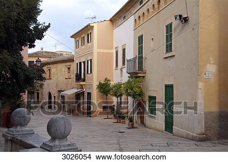 Buildings along an alley in the old town of Alcudia, Majorca, Spain View Large Photo Image Picture - Buildings along an alley in the old town of Alcudia, Majorca, Spain . Fotosearch