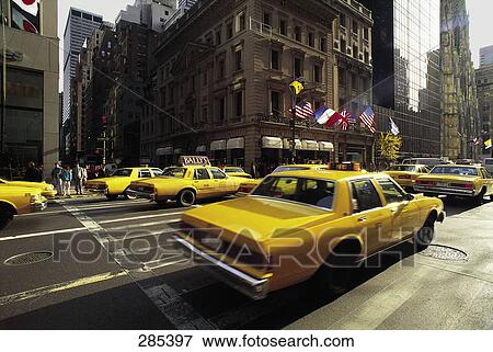Cabs on city road during rush-hour View Large Photo Image Stock Photo - Cabs on city road during rush-hour . Fotosearch