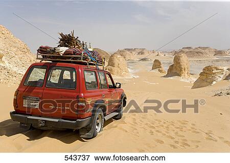 Stock Photo - Car in arid landscape, Farafra Oasis, Libyan Desert, Egypt . Fotosearch