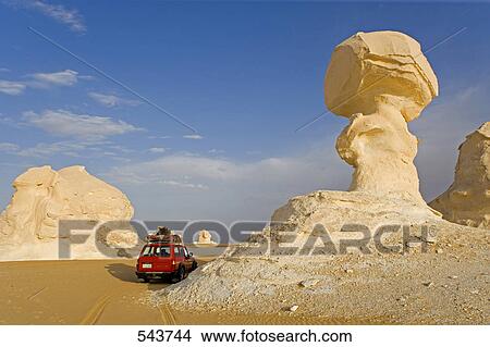 Car near rock formations in arid landscape, Farafra Oasis, Libyan Desert, Egypt View Large Photo Image Picture - Car near rock formations in arid landscape, Farafra Oasis, Libyan Desert, Egypt . Fotosearch