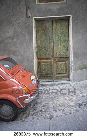 Stock Photography - Car parked in front of house, Tende, Provence-Alpes-Cote d'Azur, France . Fotosearch