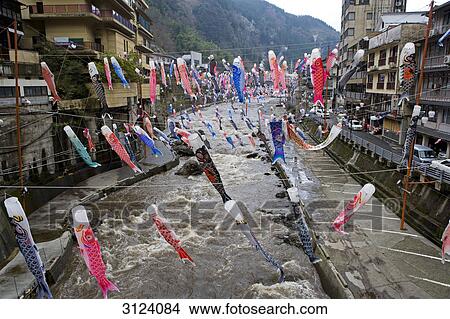 Carp-shaped wind socks hanging above a river, Oguni, Kyushu, Japan, high angle view View Large Photo Image Picture - Carp-shaped wind socks hanging above a river, Oguni, Kyushu, Japan, high angle view . Fotosearch