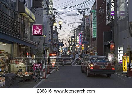 Cars on city street, Kyoto, Japan View Large Photo Image Stock Photograph - Cars on city street, Kyoto, Japan . Fotosearch