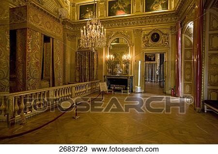 Stock Photo - Chandelier lit up in castle, Palace of Versailles, Paris, France . Fotosearch