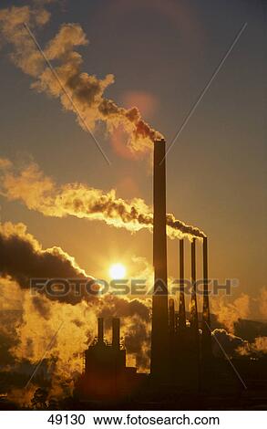 Chimneys emitting smoke at dusk View Large Photo Image Stock Image - Chimneys emitting smoke at dusk . Fotosearch
