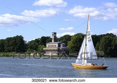 Church at the bank of the Havel River, boat sailing in the foreground, Potsdam, Germany View Large Photo Image Stock Image - Church at the bank of the Havel River, boat sailing in the foreground, Potsdam, Germany . Fotosearch