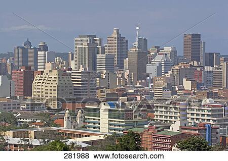 Stock Photo - Cityscape against blue sky, Durban, South Africa . Fotosearch