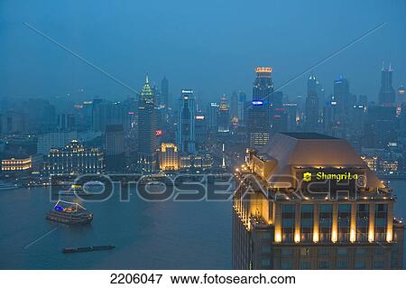 Stock Photo - Cityscape lit up at night . Fotosearch