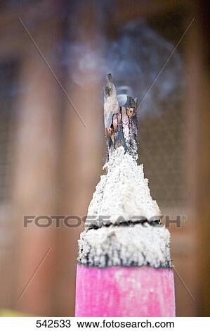 Close-up of burning incense View Large Photo Image Stock Image - Close-up of burning incense . Fotosearch