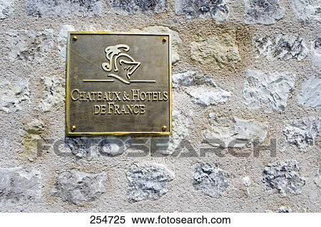 Stock Photography - Close-up of information sign on stone wall, Europe . Fotosearch