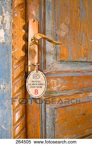 Close-up of key in door lock View Large Photo Image Stock Photography - Close-up of key in door lock . Fotosearch