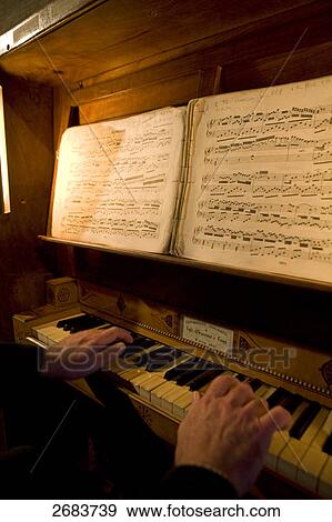 Close-up of pianist hands playing piano, France View Large Photo Image Stock Photo - Close-up of pianist hands playing piano, France . Fotosearch