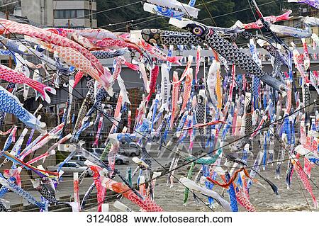 Stock Photo - Colourful carp-shaped wind socks flying in the breeze, Oguni, Kyushu, Japan, high angle view . Fotosearch