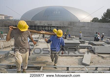 Stock Photo - Construction workers at construction site, National Opera Building, Beijing, China . Fotosearch