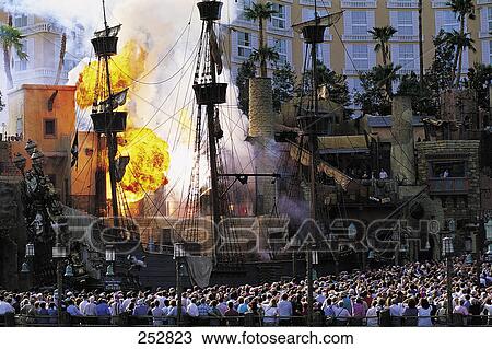 Crowd standing in front of old sailing ship firing at building View Large Photo Image Stock Image - Crowd standing in front of old sailing ship firing at building . Fotosearch