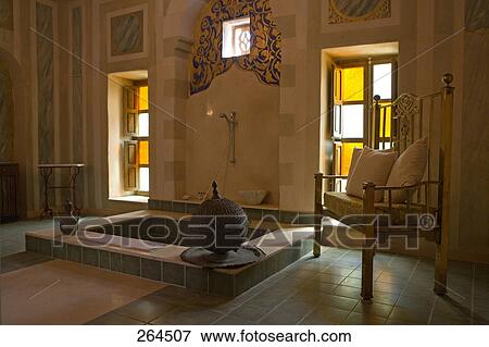 Stock Photo - Cushions on armchair in bathroom, Egypt . Fotosearch