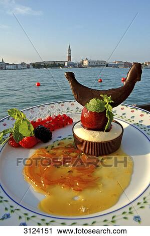 Stock Image - Dessert on a plate, Venice, Italy, close-up . Fotosearch