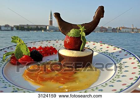 Dessert on a plate, Venice, Italy, close-up View Large Photo Image Stock Photo - Dessert on a plate, Venice, Italy, close-up . Fotosearch