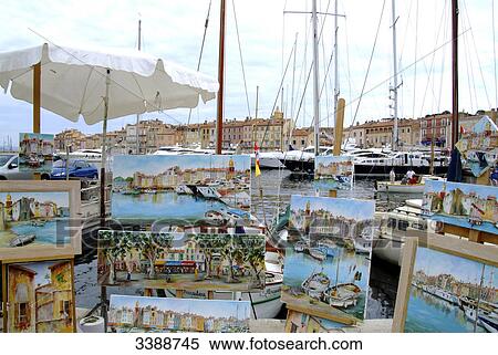 Display of paintings at the harbour of St. Tropez, France View Large Photo Image Stock Photography - Display of paintings at the harbour of St. Tropez, France . Fotosearch