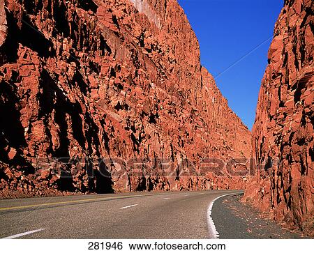 Empty country road running through mountain View Large Photo Image Stock Photograph - Empty country road running through mountain . Fotosearch