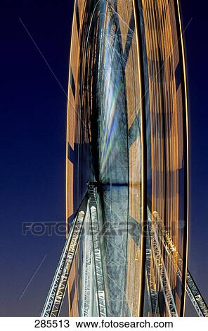 Stock Image - Ferris wheel at amusement park, Paris, Ile-de-France, France . Fotosearch