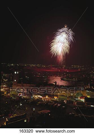 Stock Image - Fireworks in city sky, Hamburg, Germany . Fotosearch
