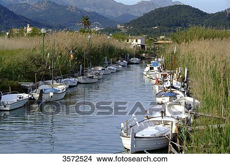 Picture - Fishing boats in natural harbour, Puerto de Andraitx, Mallorca, Spain, Europe . Fotosearch