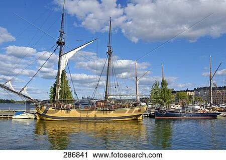 Fishing boats moored at harbor, Helsinki, Finland View Large Photo Image Stock Image - Fishing boats moored at harbor, Helsinki, Finland . Fotosearch